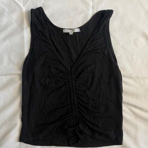 Size S black ribbed tank top in great condition with adjustable strings!